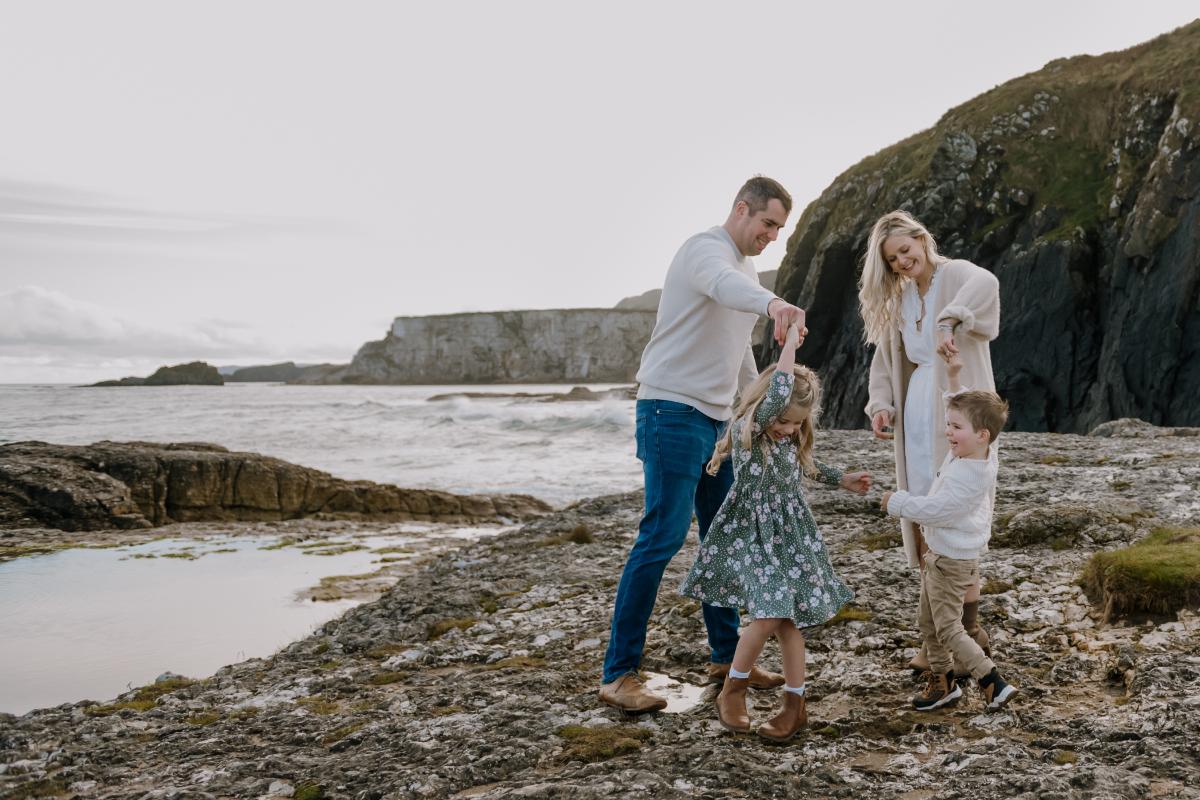 family of four dancing at Ballintoy