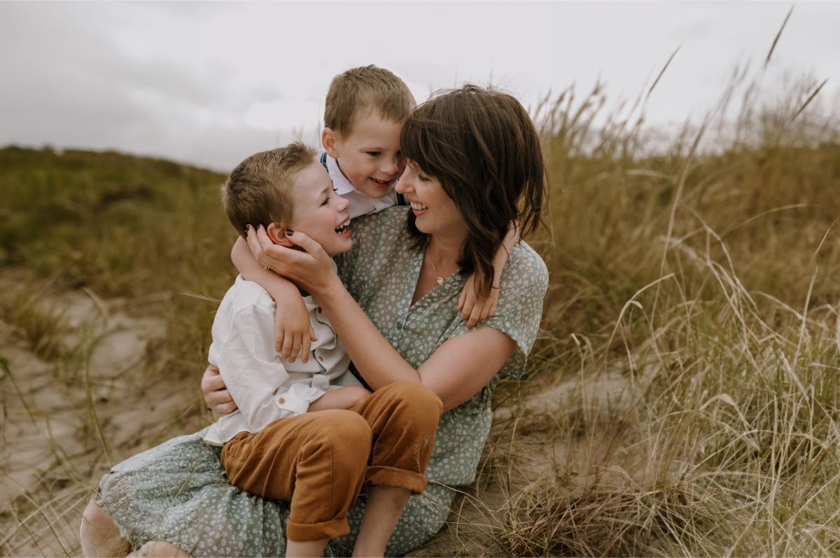mum cuddling two sons