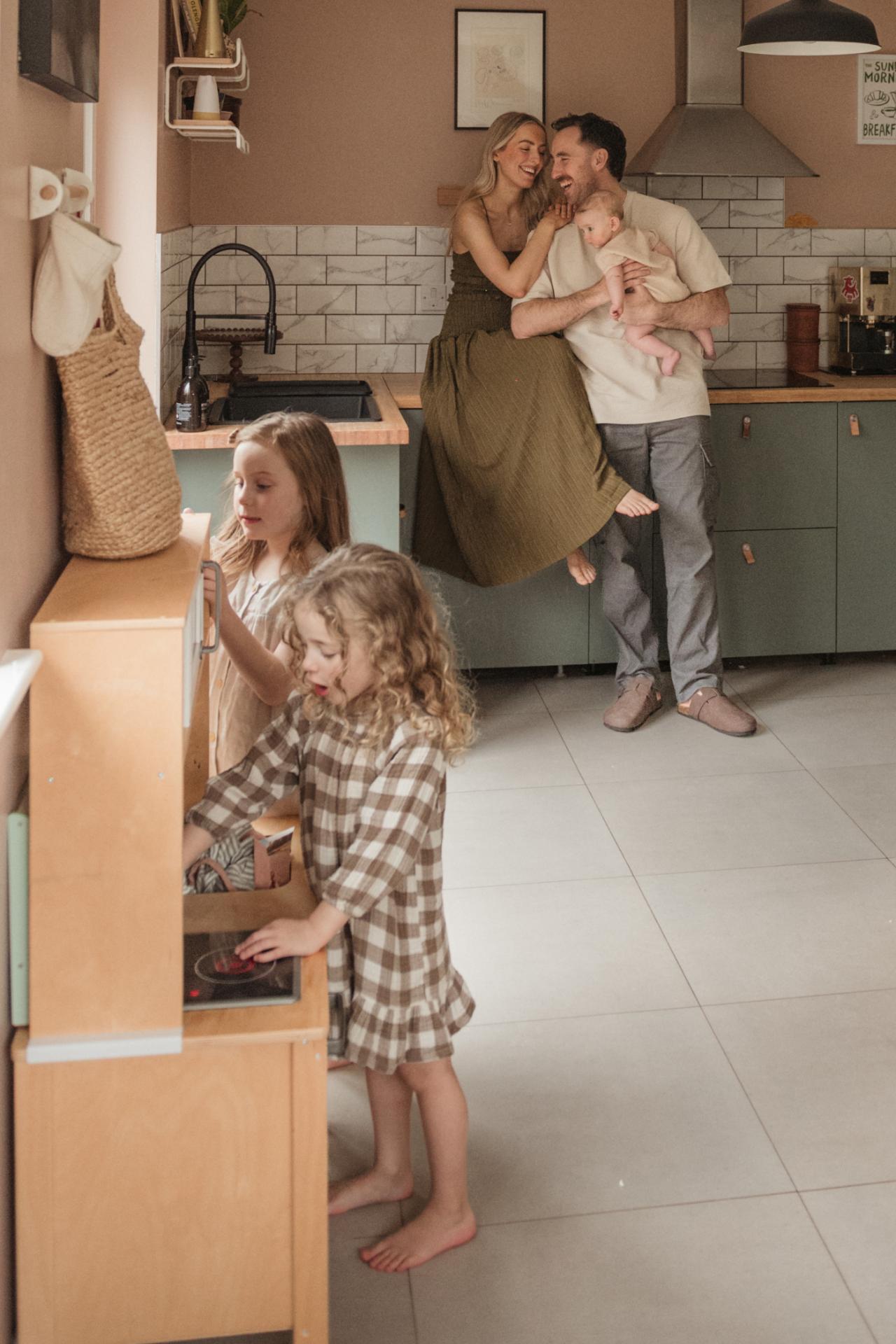 family playing in the kitchen